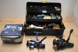 A fishing tackle box with an assortment of hooks vintage minnows etc and 5 small spinning reels