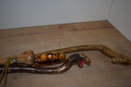 A selection of four walkig sticks/ Baton of varying lengths