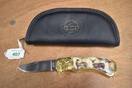 A Franklin mint collectors pocket knife depicting red deer in its original protective case
