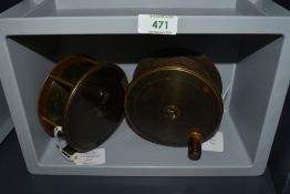 Two large brass salmon fishing reels a 4.5 inch Robertson of Glasgow and a 4.75 inch Antique Army