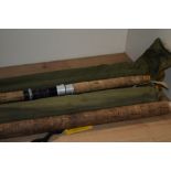 Four vintage fishing rods including an Edgar Sealy Octupus a Bruce and Walker salmon fly rod an