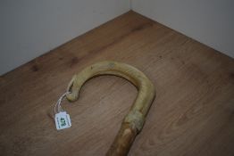 A carved horn shepherds crook walking stick measuring 137cm long