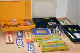 An assortment of larger lures and spinners including many unused including Rapala, Abu, Miniwobla,