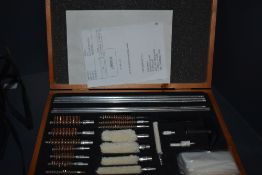 A complete gun cleaning kit for both shotgun and rifle (writing to front and top of box)