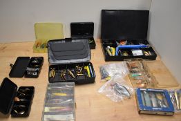 An assortment of small lures, spinners and minnows in several compartmented boxes many vintage