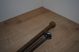 Two Antique whips one by Norton and Co measuring 99cm long and another silver topped measuring