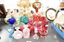 A quantity of 20th-century glass ware, to include a selection of cranberry glass; a small Empoli-