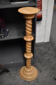 A 20th-century turned pine jardinière stand, featuring a barley-twist column design, unmarked,