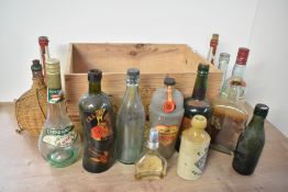 A collection of fourteen 20th-century bottles, including, for example, Jonas Alexander & Sons of