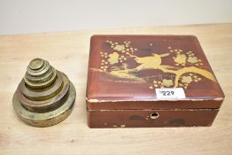 A set of early 20th-century brass nesting weights, compromising of eight weights with various makers