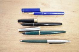 Two Parker fountain pens. A Parker 45 in Green with lustraloy cap having gold trim and a Parker 15