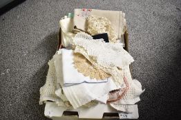 A quantity of 20th-century soft goods, to include hand made doilies, tablecloths, table runners