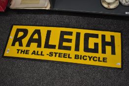 A contemporary reproduction Raleigh Cycles metal and enamel sign, 92cm x 31cm, condition is