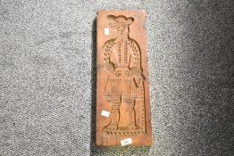 Thought to be 20th-century Dutch hardwood speculaasplank, featuring double sided hand carved figural