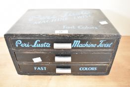A vintage Peri-Lusta wooden 'Machine Twist' advertising cotton thread box, featuring three