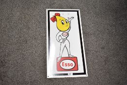 A modern reproduction Esso metal vintage-style 'Oil Drip Girl' advertising sign, approximately
