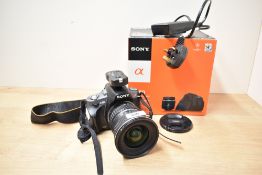 A Sony Alpha A380 DSLR camera with SD 11-16 F2.8 (IF)DX lens, a Sony 3.5-5,6 18-70mm lens, and flash