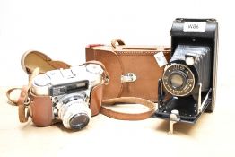 A Kodak Sis-20 Junior folding camera and A Carl Braun AMC M235 camera with Steinheil Munchen