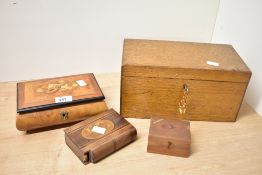 Four late 19th to 20th-century wooden boxes, to include a Victorian puzzle book-shaped box, having