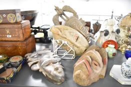 Set of four African hand-carved wooden tribal masks, presumed Ivory Coast examples, featuring