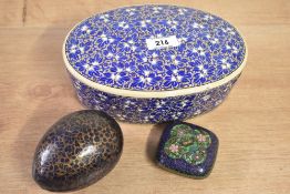 Two early 20th-century Indian-style papier-mâché boxes, including an egg-shaped example with