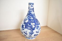 A large Chinese blue and white pottery tianqiuping-style vase, decorated with one large coiled