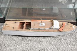 A 20th-century wooden model of a boat, 58cm, condition is consistent with age and use, thought to be