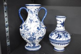Two 20th-century presumed German Meissen-style blue and white porcelain vases, featuring floral