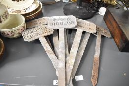 A quantity of early 20th-century cast metal Botanical Plant labels, used for identifying specific