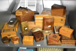 A quantity of 20th-century wooden boxes from around the world, to include puzzle boxes disguised