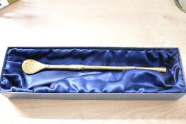 A 20th-century South American gilded metal bombilla, a filtered straw used for drinking Yerba Mate