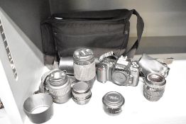 A Nikon F-501 camera body with Nikon Nikkor 70-300 1:4-5,6G lens, a AF-S DX Nikkor 18-55mm 1:3,5-5,