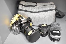 A Canon A-1 camera with Canon FD 35-105mm 1:3,5 lens, a Canon FD 50mm 1:1,8 lens, a Sunpak flash
