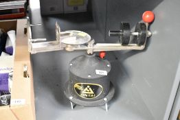 A Jintai centrifugal casting machine, h27cm, used in dental laboratories for producing oral