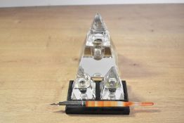 A selection of 19th-century crystal glass pyramid-shaped inkwells, to include a large, free standing