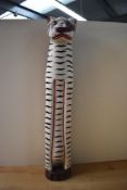 A tall vintage Balinese hand-carved timber tiger statue, of slender form, having hand-painted deep