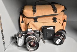 A Minolta 5000AF camera with Zoom 35-70mm 1:4 lens, Tokina 1:4-5,5 70-210mm lens, Minolta Program