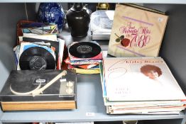 A late 20th-century Mettoy Musicmaker Solid State record player, accompanied by a collection of 7-