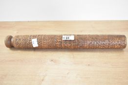 A presumed 20th-century African hand-carved wooden ceremonial baton, featuring geometric banded