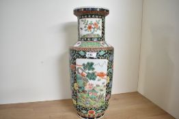 A large Chinese porcelain famille verte vase, of baluster form featuring colourful foliate and