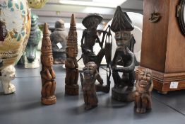 A selection of six 20th-century wood-carved African art sculptures, featuring stylised headdresses