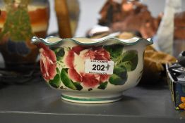 A 19th-century Scottish Wemyss Ware pottery bowl, having a scalloped edge with delicate cabbage rose
