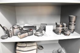 A Canon EOS camera body with Canon EF 70-300mm 1:4-4,5 lens, Canon EF 28-105mm 1:3,5-4,5 lens, a