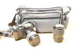 A Nikon F-301 SLR 35mm camera with Toki na SZ-X 80-200mm 1:4,5-5,6 lens and Sigma Zoom Master 1:2,