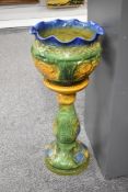 A large early to mid-20th-century majolica-glazed jardiniere, featuring a deep blue scalloped