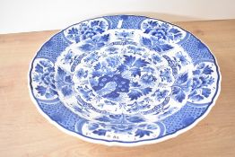 A large mid 20th-century De Koninklijke Porceleyne Fles Delft ware blue charger painted by W.M.G