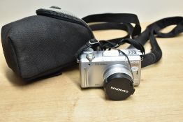 An Olympus C-765Ultra Zoom Digital Camera with lympus 1:2,8-3,7 63mm lens, in soft camera case