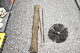 A late 19th to early 20th-century chimney sweep brush kit, to include 2 poles, one large, round