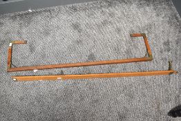 Two thought to be late 19th to early 20th-century measuring wandage rod–like apparatus, each