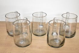 A set of five 20th-century studio art glass tankard-style mugs, pontil mark to base, (5),